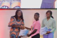 Adwoa-Wiafe-Chief-Corporate-Services-and-Sustainability-Officer-for-MTN-Ghana-presenting-a-certificate-to-one-of-the-finalists-of-Girls-in-ICT-in-the-Greater-Accra-region