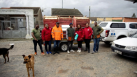 FOUR-PAWS-and-staff-at-Mdzananda-Animal-Clinic-proudly-stand-beside-the-newly-donated-kennels-ready-to-provide-warmth-and-safety-to-67-dogs-in-need-in-honor-of-Mandela-Day-Pcture-supplied