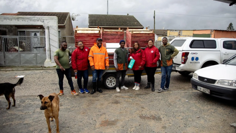 FOUR-PAWS-and-staff-at-Mdzananda-Animal-Clinic-proudly-stand-beside-the-newly-donated-kennels-ready-to-provide-warmth-and-safety-to-67-dogs-in-need-in-honor-of-Mandela-Day-Pcture-supplied